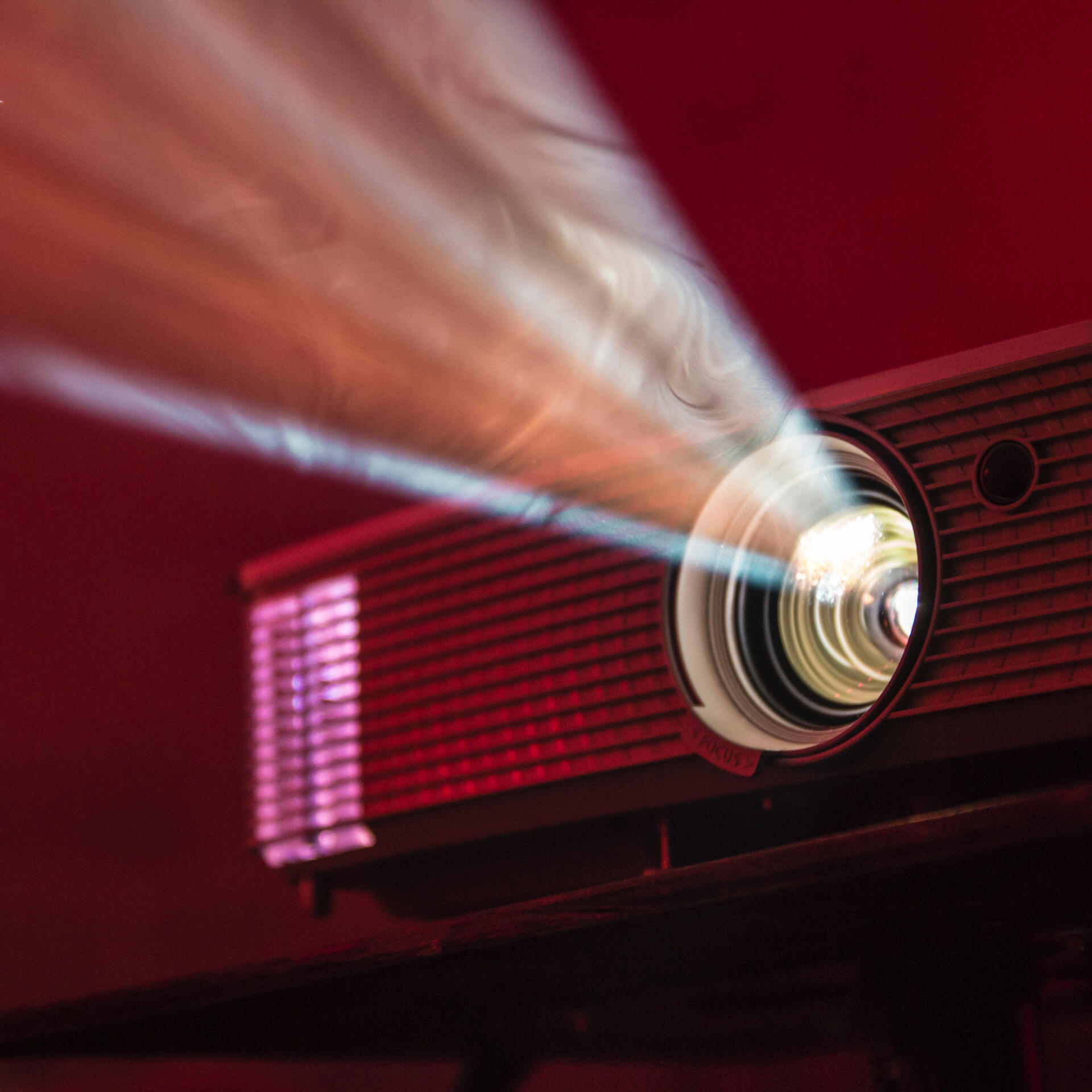 turned on LED projector on table